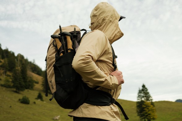 Photo of three hiking packs on rocky ground