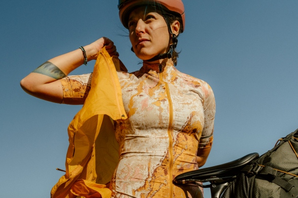 Frontal close-up of a cyclist in summery functional clothing