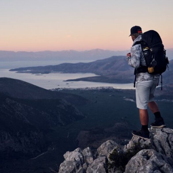 A man hiking during sunset